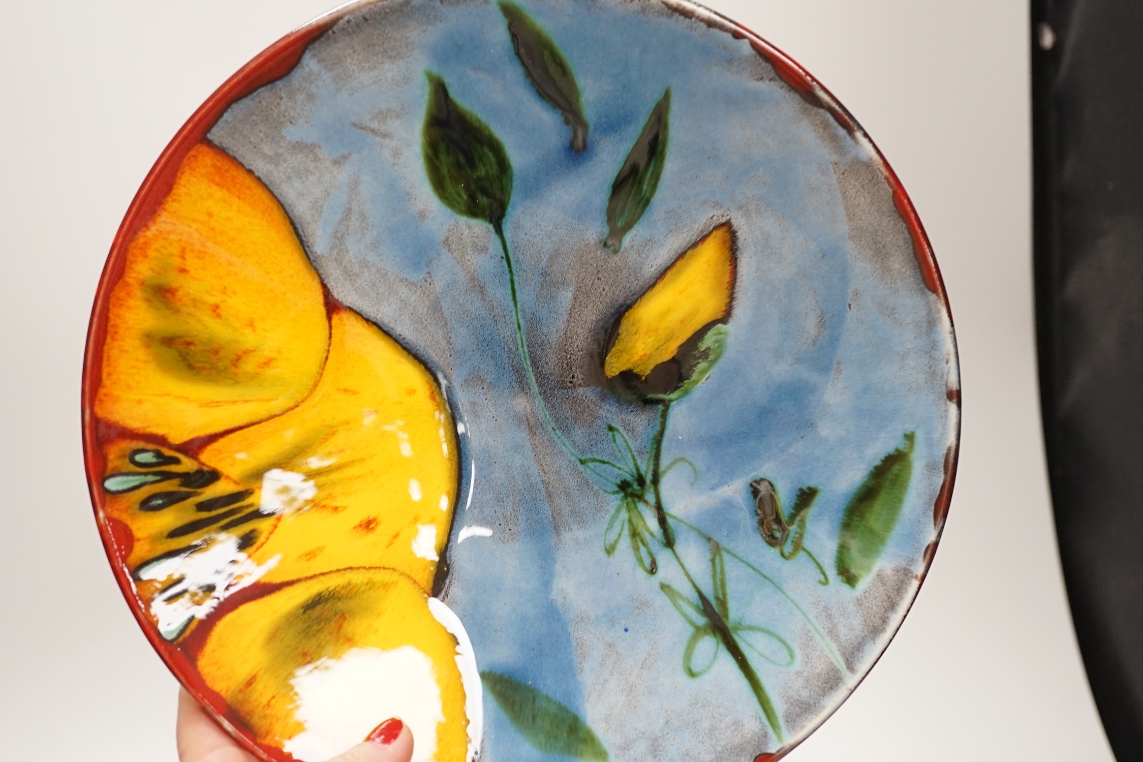 Five items of 1930's/40's Poole pottery, two Delphis plates and a boxed yellow poppy plate